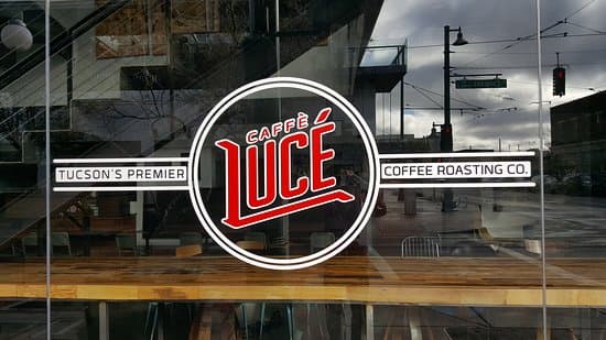 Window with the Caffe Luce Logo on it, looking into the cafe.