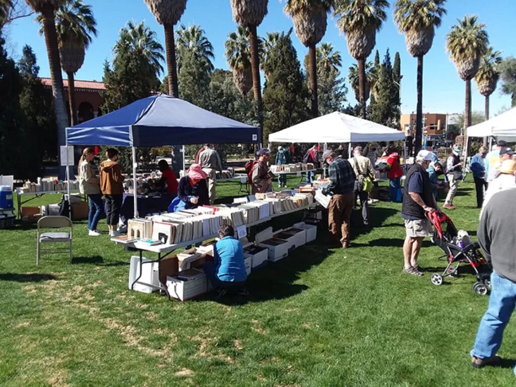 Tents on a lawn with books for sale