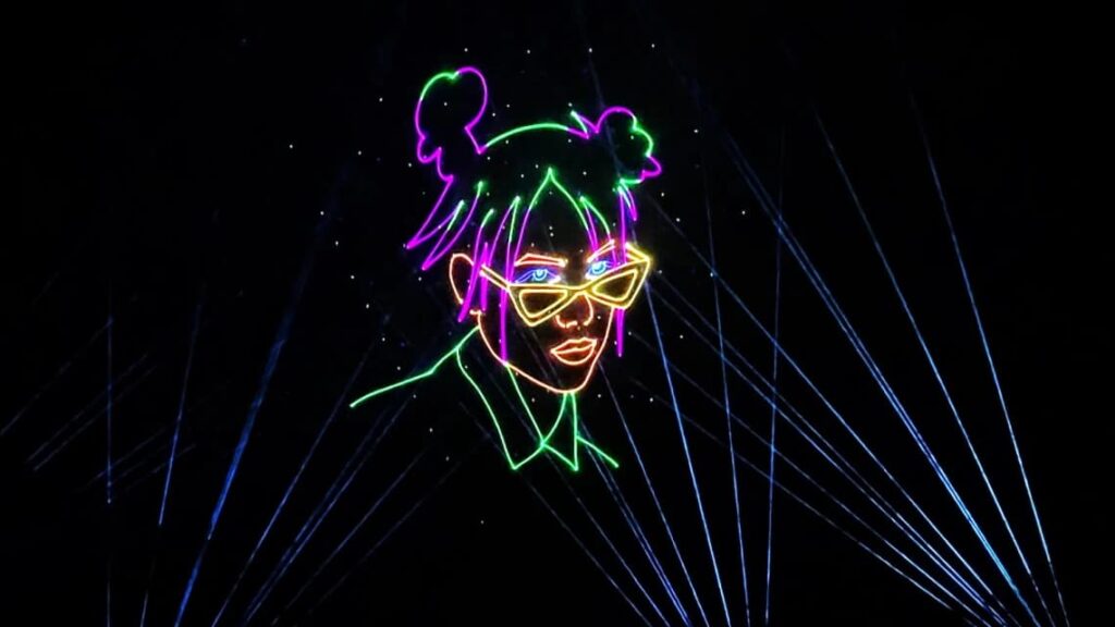 Lasers creating the face of Billie Eilish